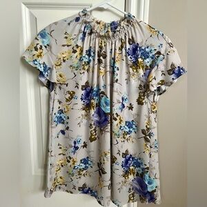 Like new Express top in M.  Neutral beige top with beautiful flower accents.